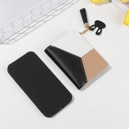 Black phone case and wallet with a keychain on a light gray background