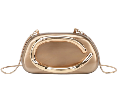 Gold clutch bag on a light beige background