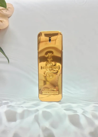 Gold-colored perfume bottle with brand logo
