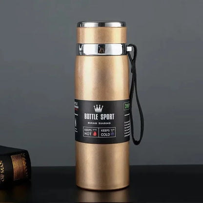 Gold insulated bottle with a label