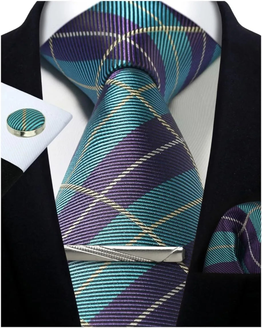 Plaid tie with matching pocket square and cufflinks on a black suit jacket.