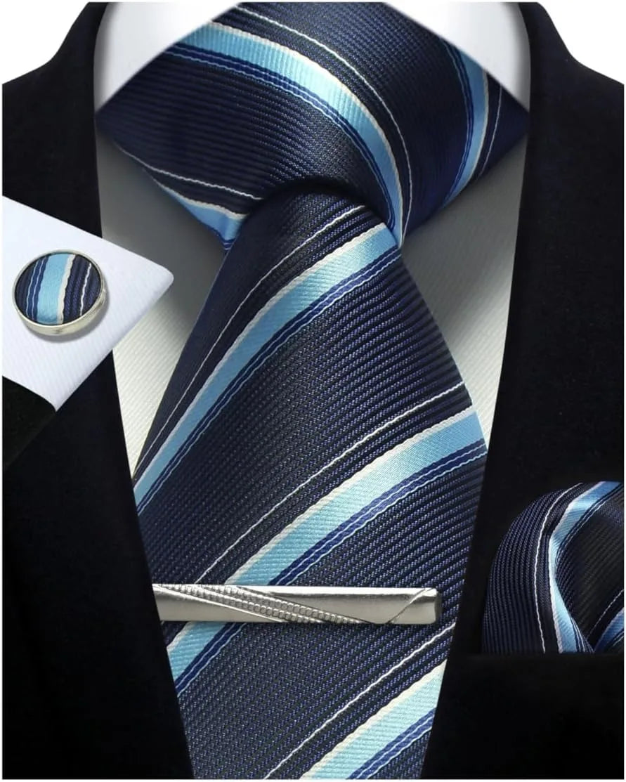 Navy and light blue striped tie with matching pocket square and cufflinks on a black suit.