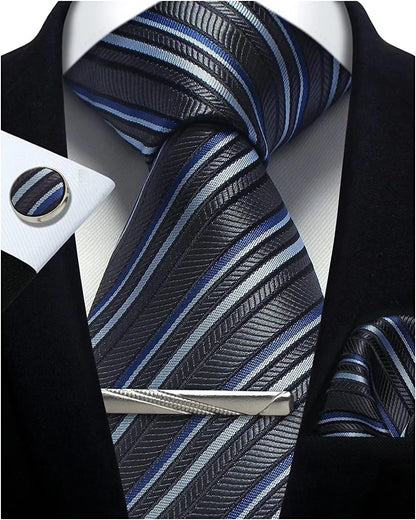 Striped tie with matching pocket square and cufflinks on a suit.