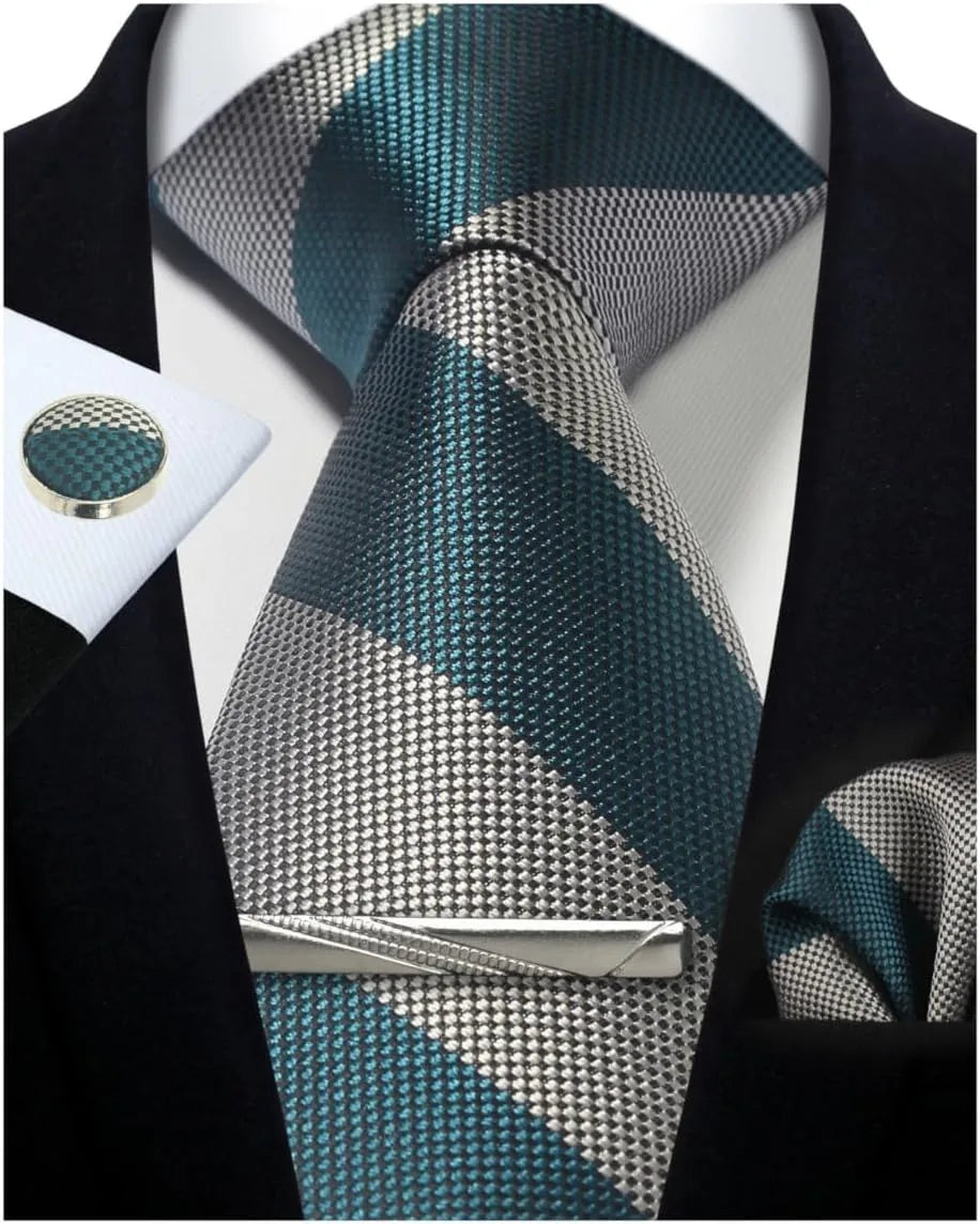 Teal and gray patterned tie with matching pocket square and cufflinks on a black suit.